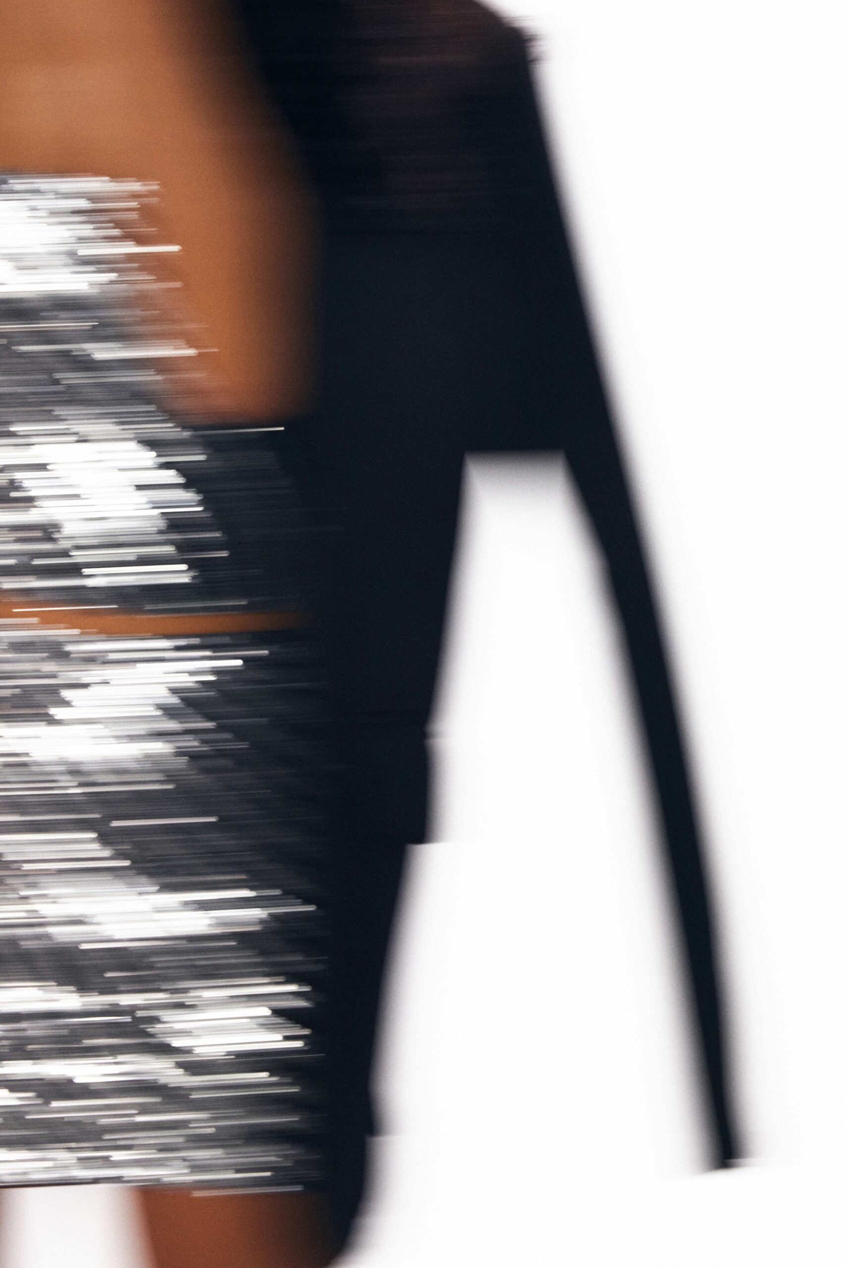 Blurry image of a woman in a glittery dress
