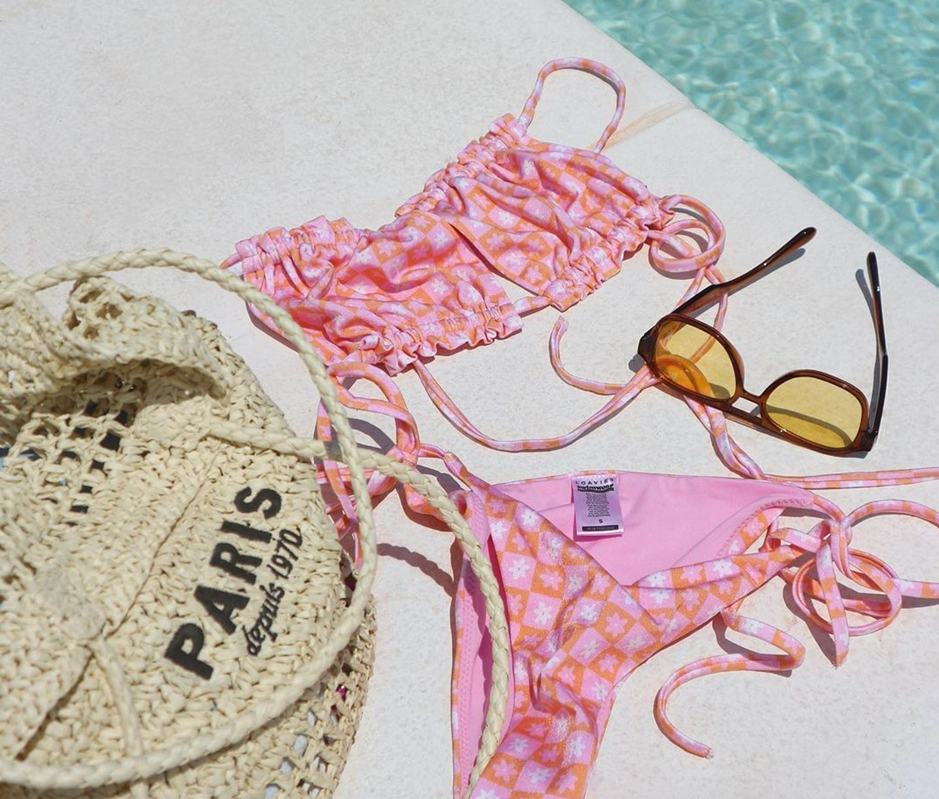 Image of a pink bikini beside a pool